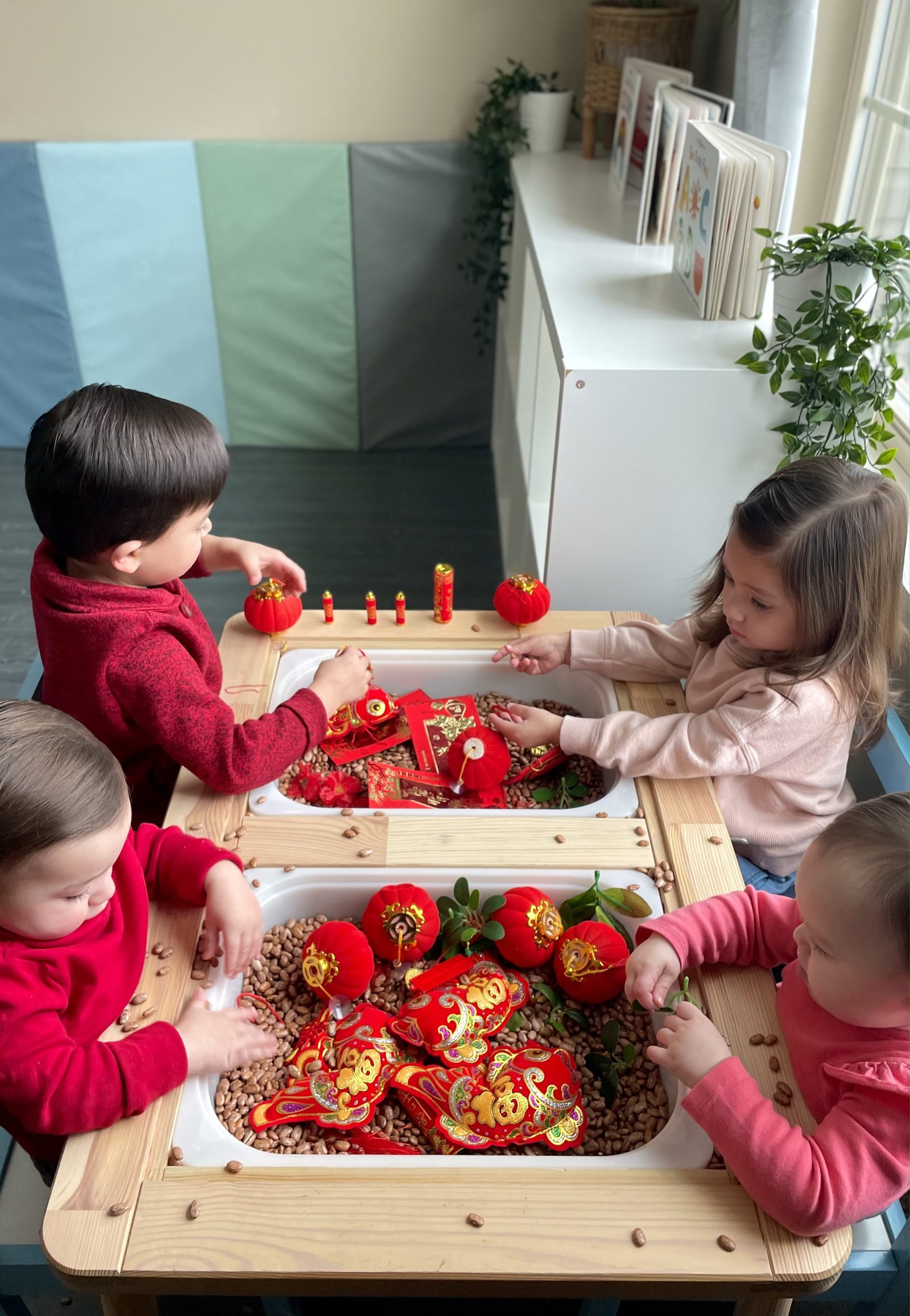 Lunar New Year sensory table with red lanterns
